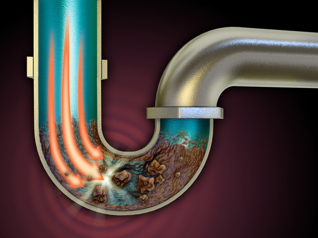 Illustration showing debris buildup inside a blocked drain pipe