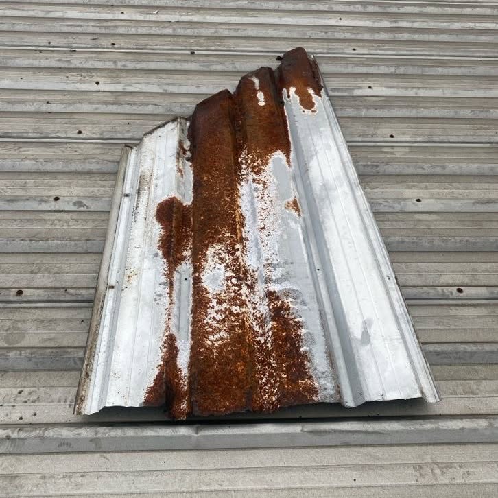 Heavily rusted metal roof sheet removed from a commercial property in Burwood.