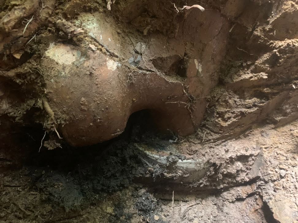 Damaged clay sewer pipe found during excavation at a Glen Iris property.