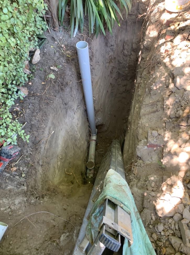 Excavated trench with new PVC sewer pipework at a Glen Iris home.